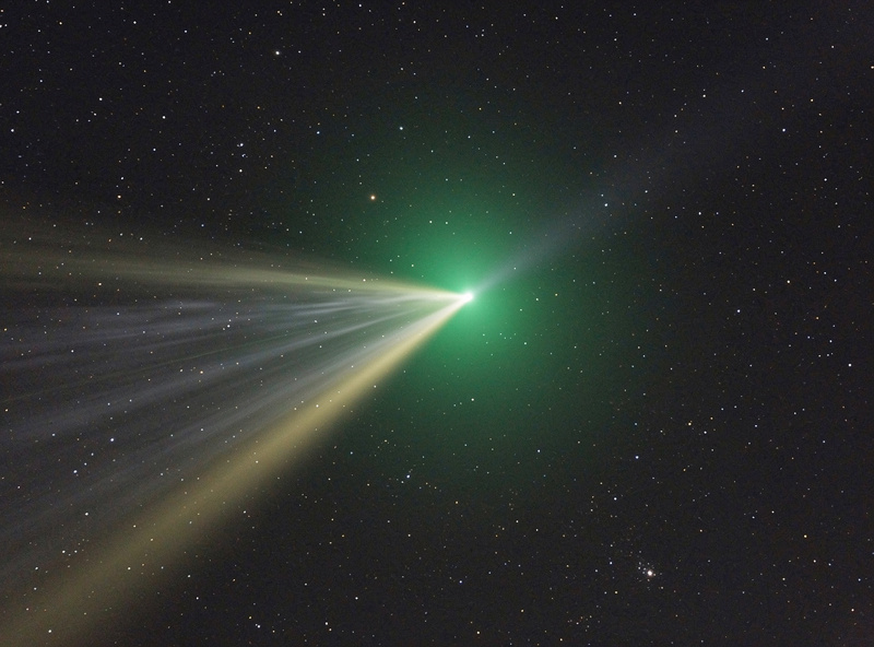 Comet showing green coma and dust tail