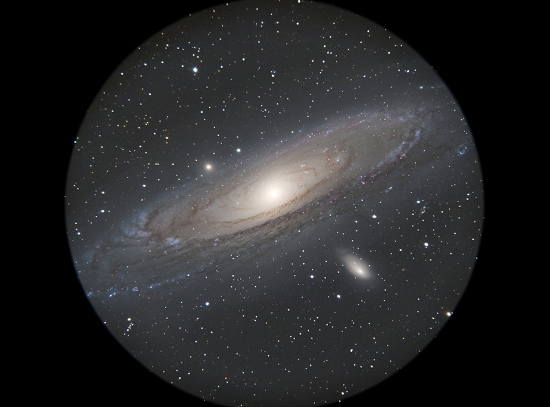 Amateur telescope view of the Andromeda Galaxy as a faint elongated glow with bright core