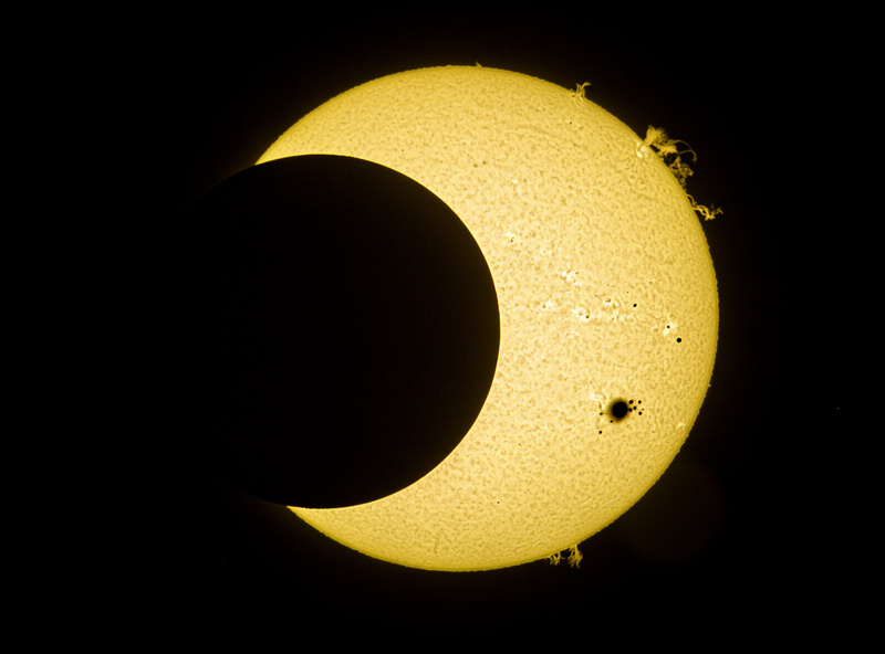 Partial solar eclipse showing Moon covering Sun