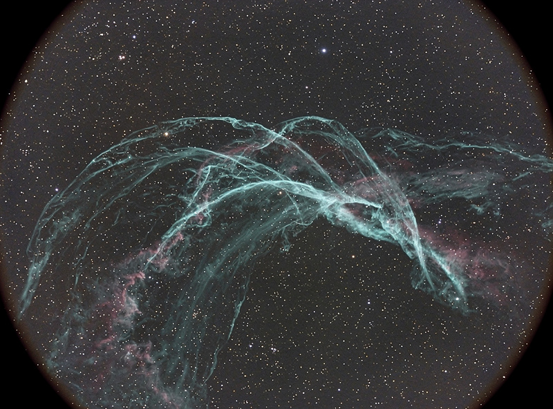 Filamentary arcs of the Veil Nebula supernova remnant visible through an O-III filter