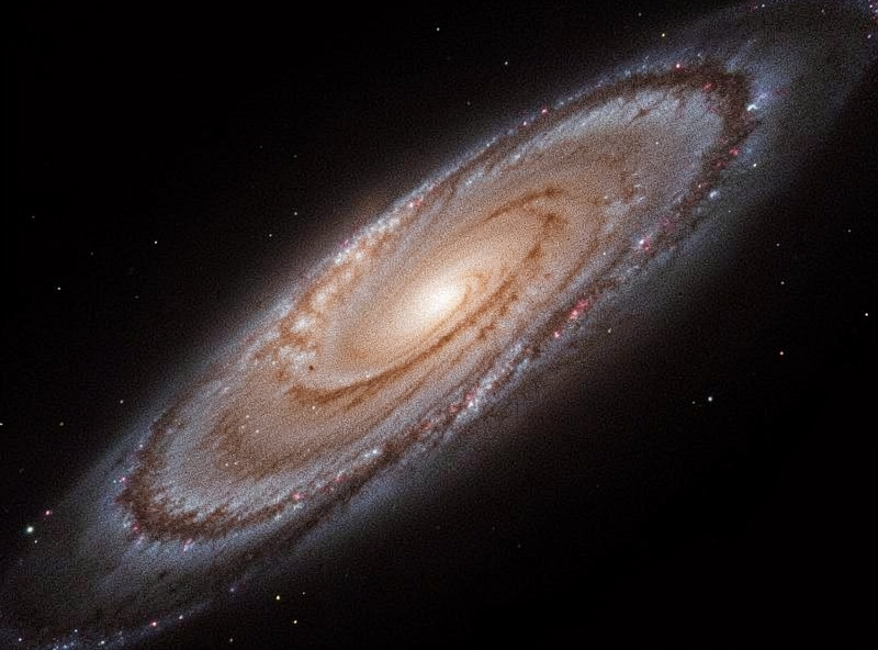 A stretched nebula image with grainy background noise being smoothed while structure is preserved