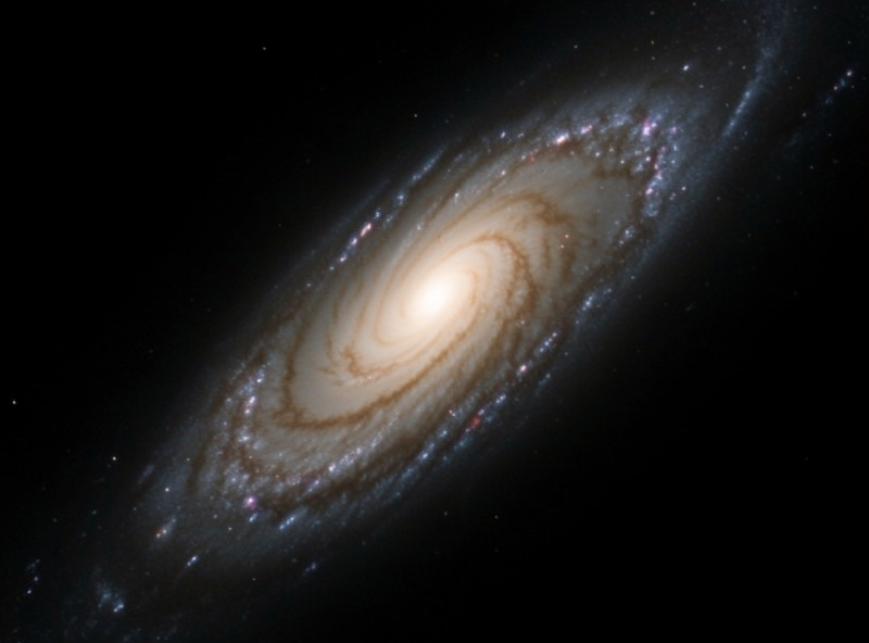A galaxy image with spiral arm detail being sharpened, crisp structure against a smooth background